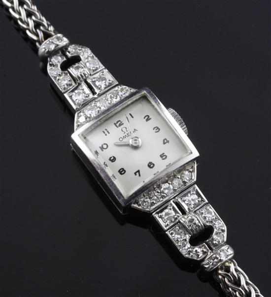 A ladys 1940s platinum and diamond set Omega manual wind cocktail watch, in Mappin & Webb box.